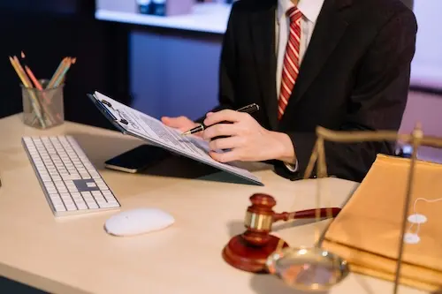 Board certified criminal defense attorney Chris Warren at Cowboy Law Group in The Woodlands Texas reviewing a DWI defense case file for a client facing DWI charges in Montgomery County