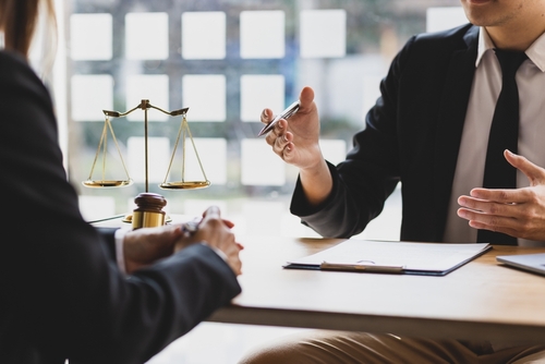 Photograph of a compassionate San Antonio criminal defense lawyer meeting with a new client for a free consultation about federal charges and criminal allegations.