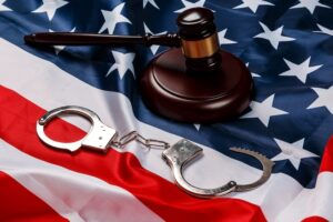 Experienced federal gun trafficking defense attorney reviewing case files in Texas law office