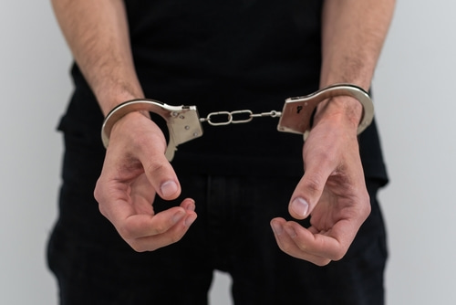 A man arrested in handcuffs needs a lawyer for the hardest criminal cases to beat.
