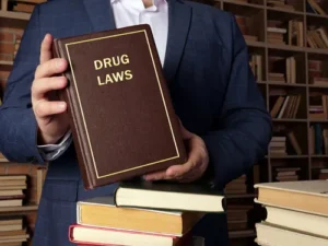 Federal drug charge lawyer reviewing a book on drug laws at Cowboy Law Group in The Woodlands Texas.