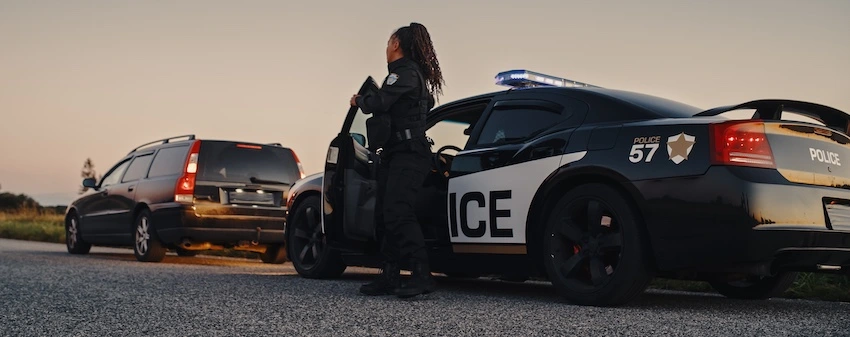 A criminal defense lawyer is being represented by a policewoman who is about to make an arrest.