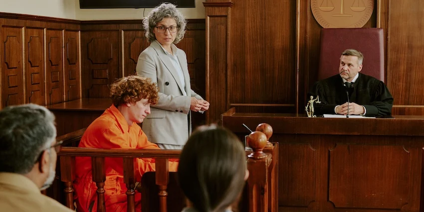 A criminal defense lawyer from Cowboy Law Group is representing a client in court.