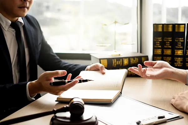 Cowboy Law Group juvenile attorney speaks to a client
